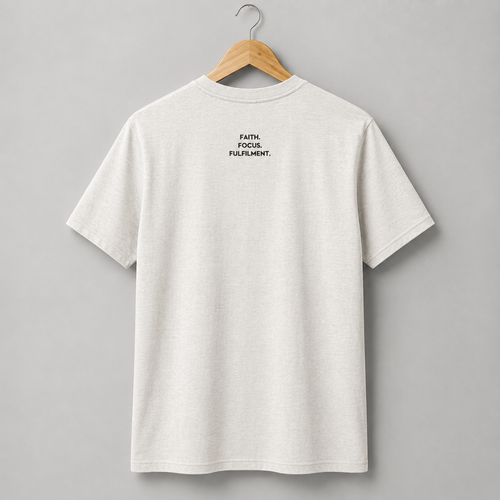 A vintage white short-sleeve crewneck t-shirt hanging on a wooden hanger. The back of the shirt features a small slogan Faith. Focus. Fulfilment. in black text between the shoulder blades.