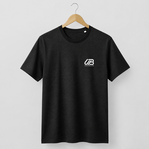 A black short-sleeve crewneck t-shirt hanging on a wooden hanger. The shirt features a small white 'UB' logo on the left chest with 'Ummah Balance' printed underneath.